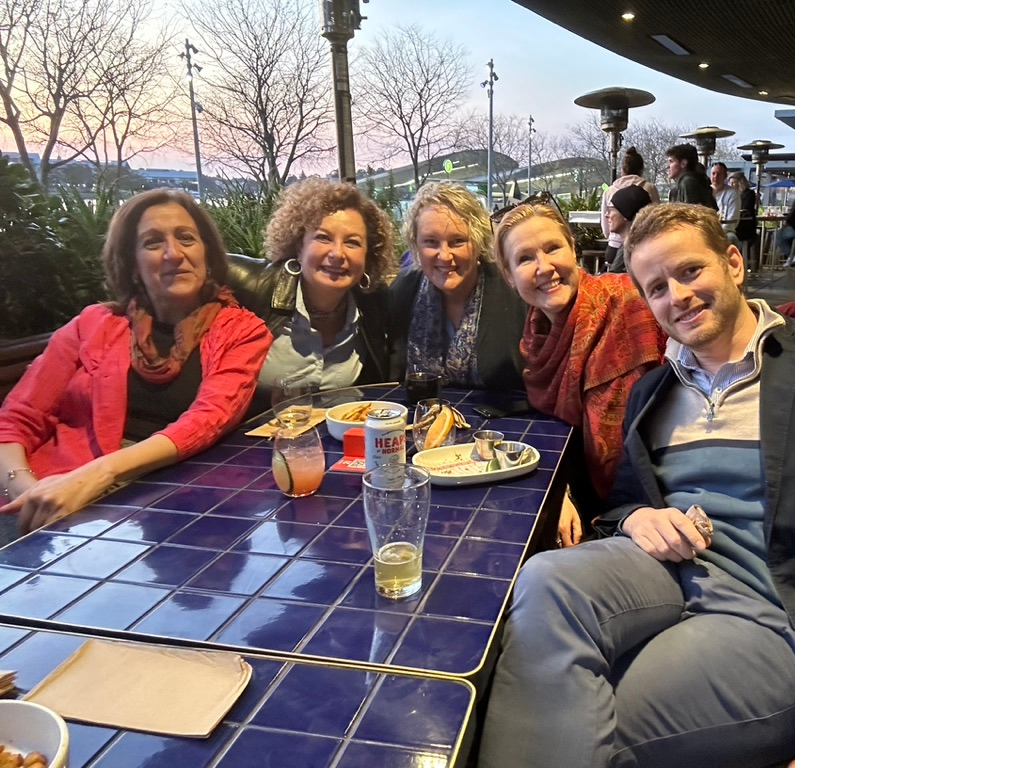 Colleagues sharing a meal together outdoors